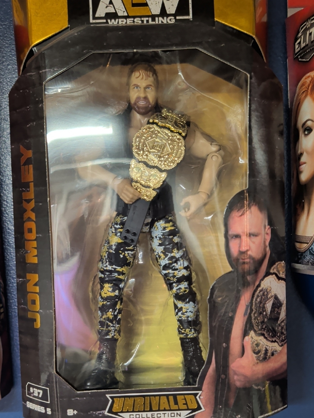 AEW Unrivaled Collection Jon Moxley Action Figure - Black & Yellow Camo Pants